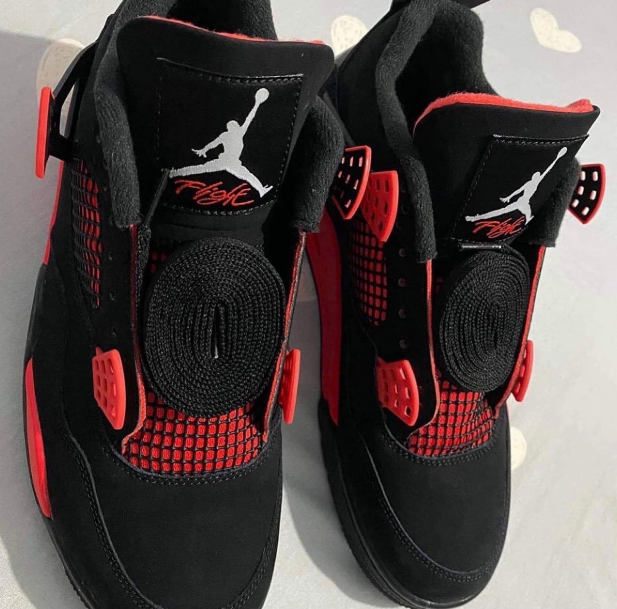 First Look At The Air Jordan 4 Retro "Red Thunder" Sneaker Buzz
